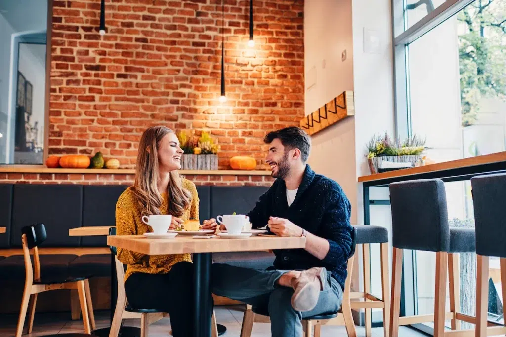 Picture-of-young-couple-dating-at-cafe_