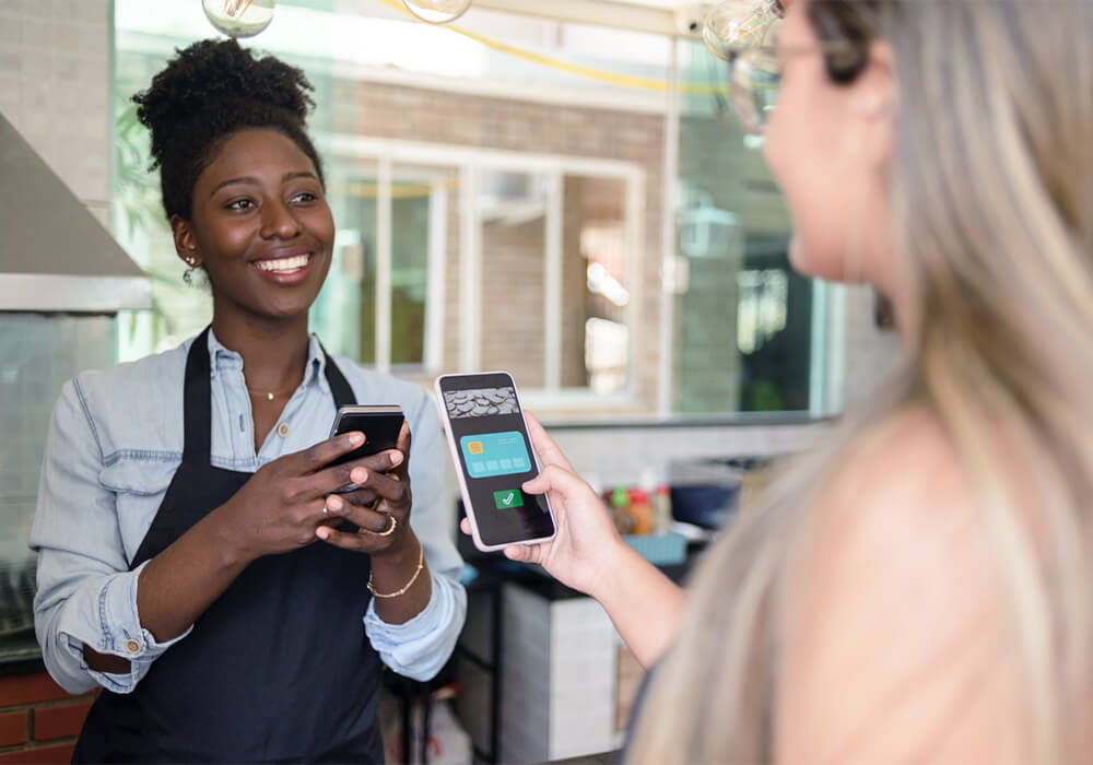 Contactless payment being sent and received on smartphones