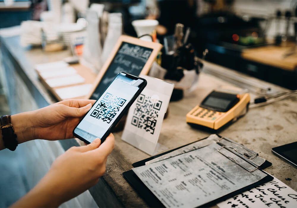 Diner scans QR code menu on smartphone