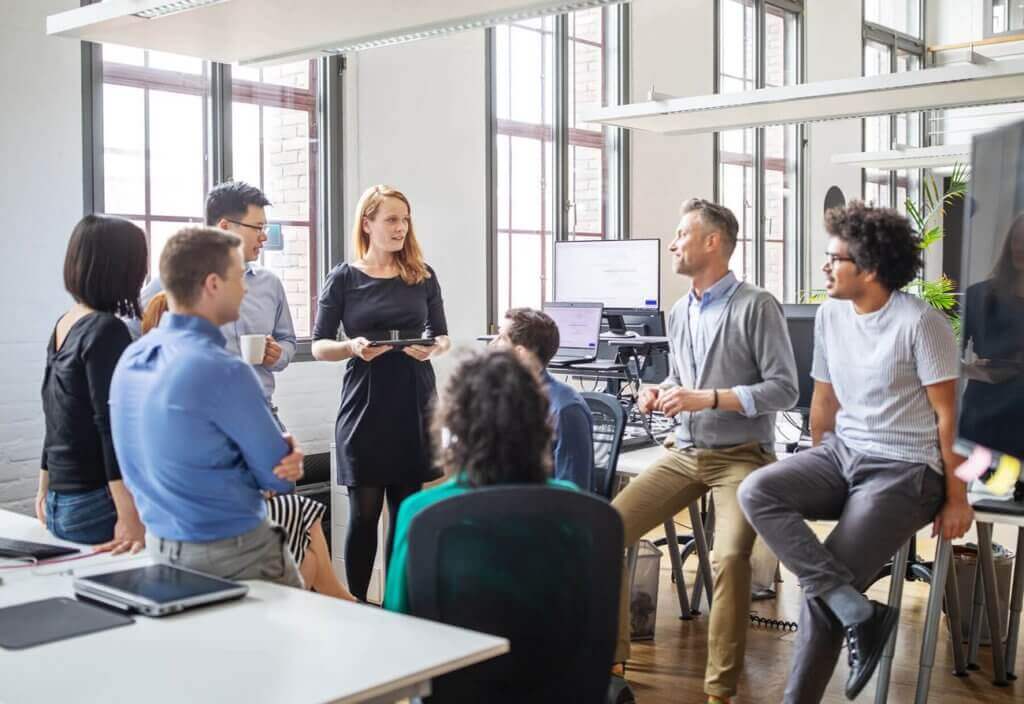 Employee team meeting in office
