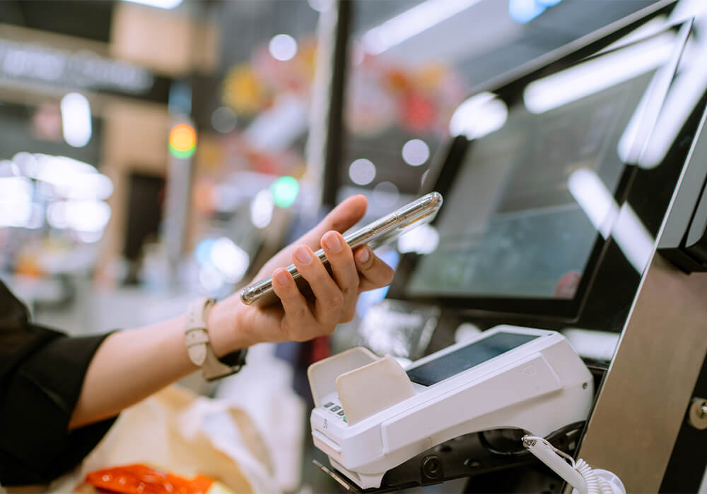 Tap to pay using smart phone at self-checkout station