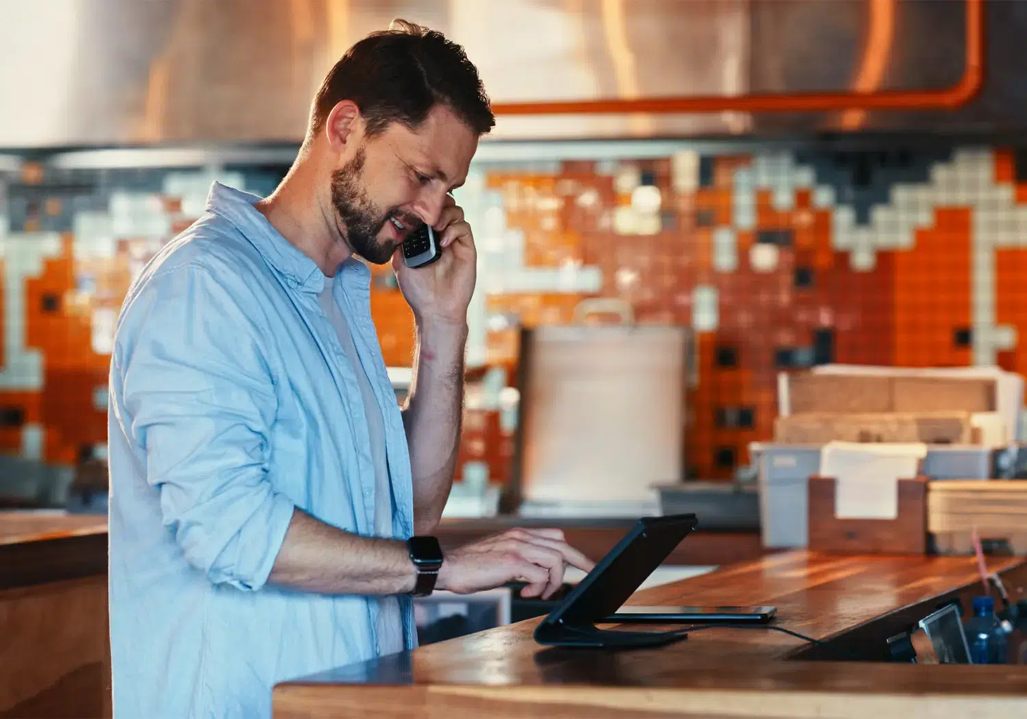 Server taking order on kiosk