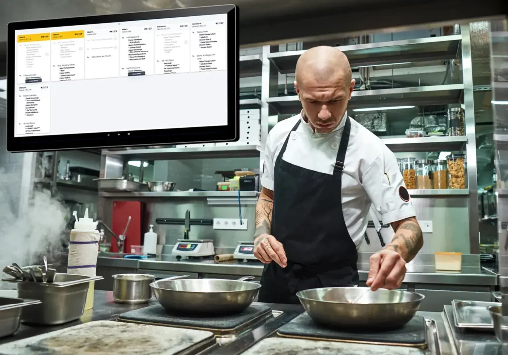 chef preparing food with kitchen display system